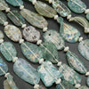 Green and blue roman glass oval beads.