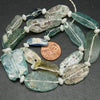Green and blue roman glass oval beads.