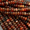 Red banded polished agate beads.