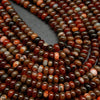 Red banded polished agate beads.