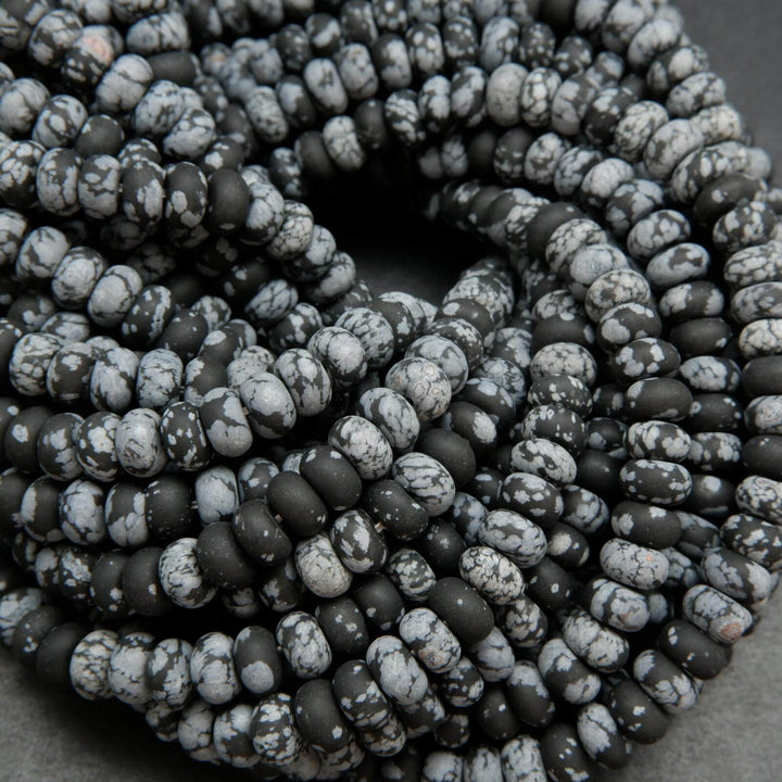 Matte finish rondelle snowflake obsidian beads.