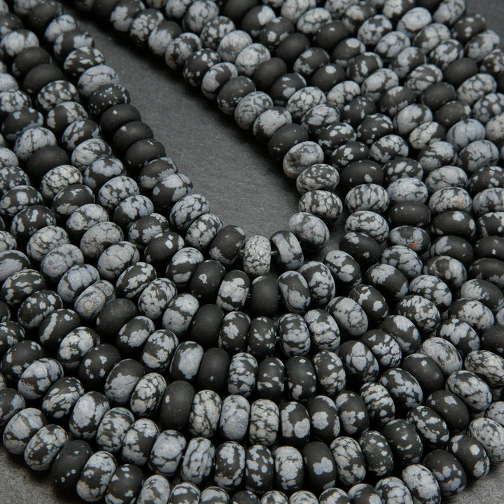 Matte finish rondelle snowflake obsidian beads.