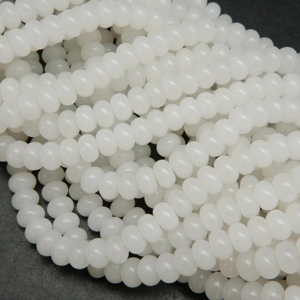 Polished rondelle white jade beads.