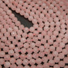Faceted pink rose quartz beads.