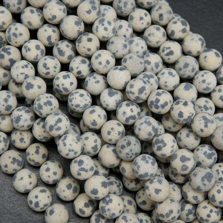 Beige to tan color matte finish Dalmatian Jasper beads. Round matte finish beads with black spots. 
