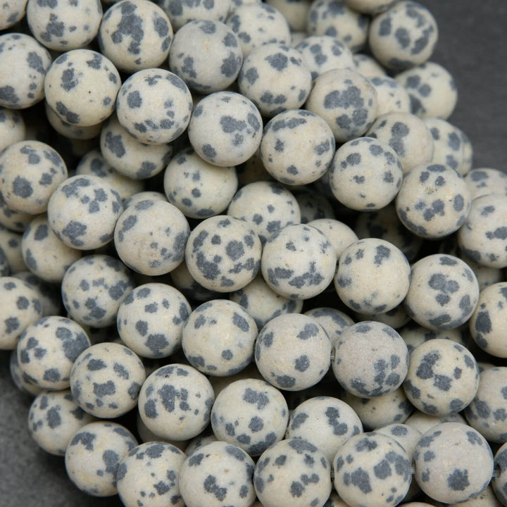 Beige to tan color matte finish Dalmatian Jasper beads. Round matte finish beads with black spots. 