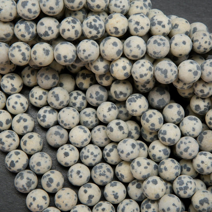 Beige to tan color matte finish Dalmatian Jasper beads. Round matte finish beads with black spots. 