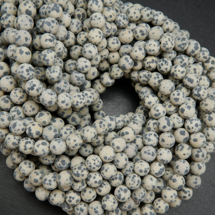 Beige to tan color matte finish Dalmatian Jasper beads. Round matte finish beads with black spots. 