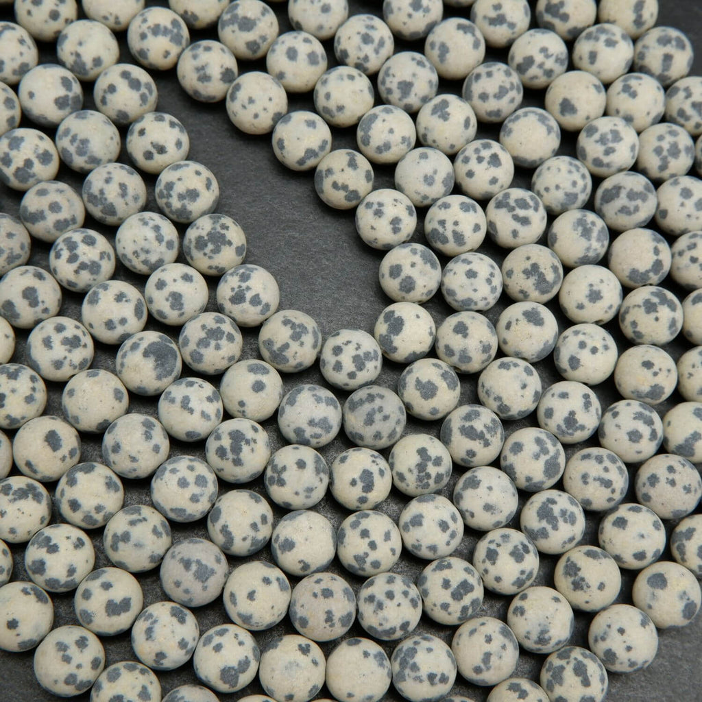 Beige to tan color matte finish Dalmatian Jasper beads. Round matte finish beads with black spots. 