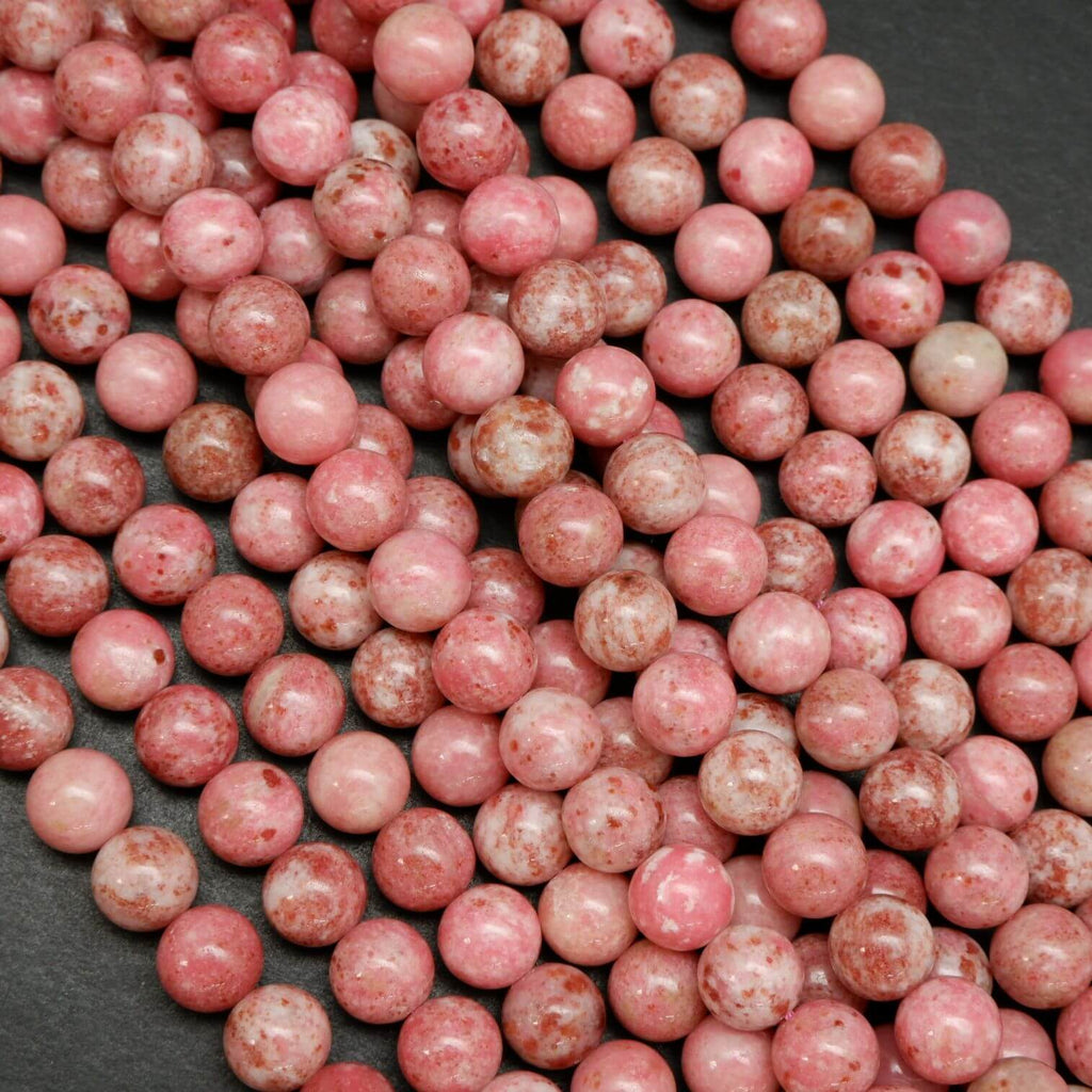 Natural pink thulite beads speckled with deep pink