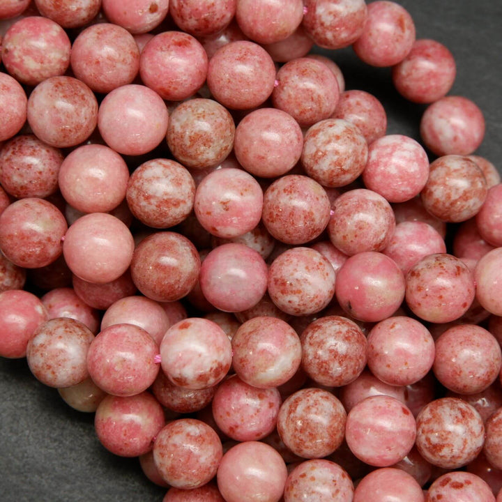 Natural pink thulite beads speckled with deep pink