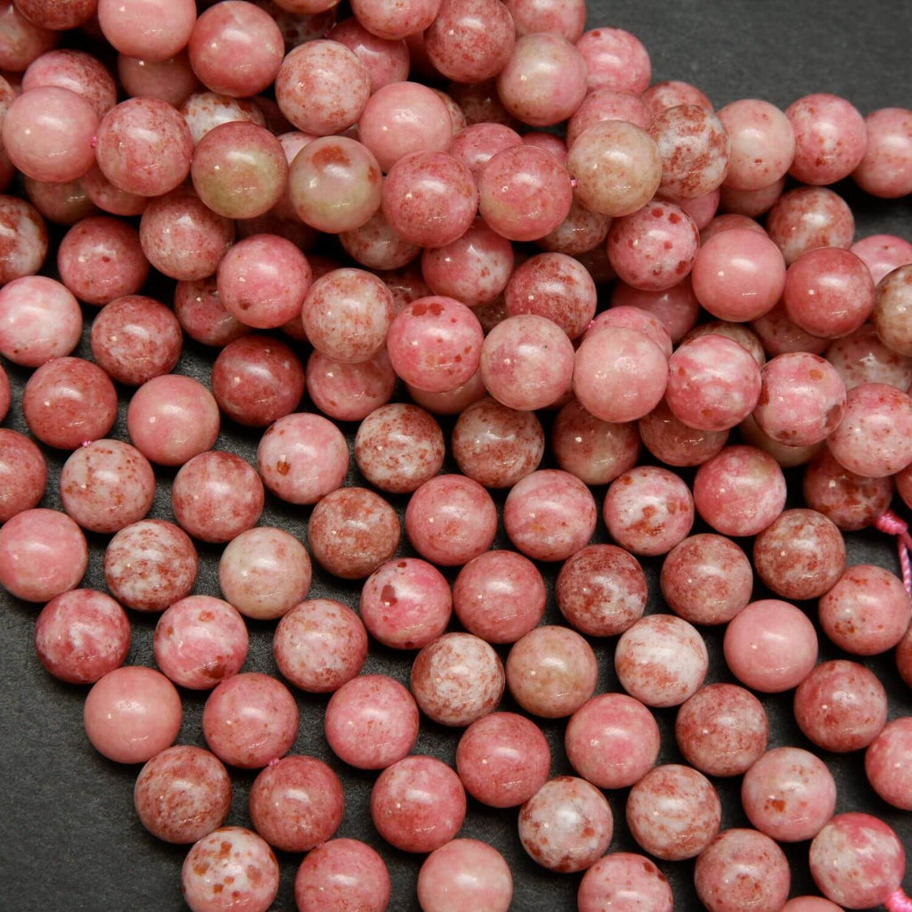 Natural pink thulite beads speckled with deep pink