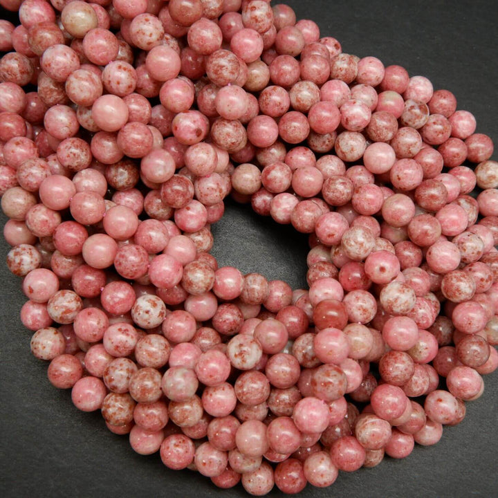 Natural pink thulite beads speckled with deep pink