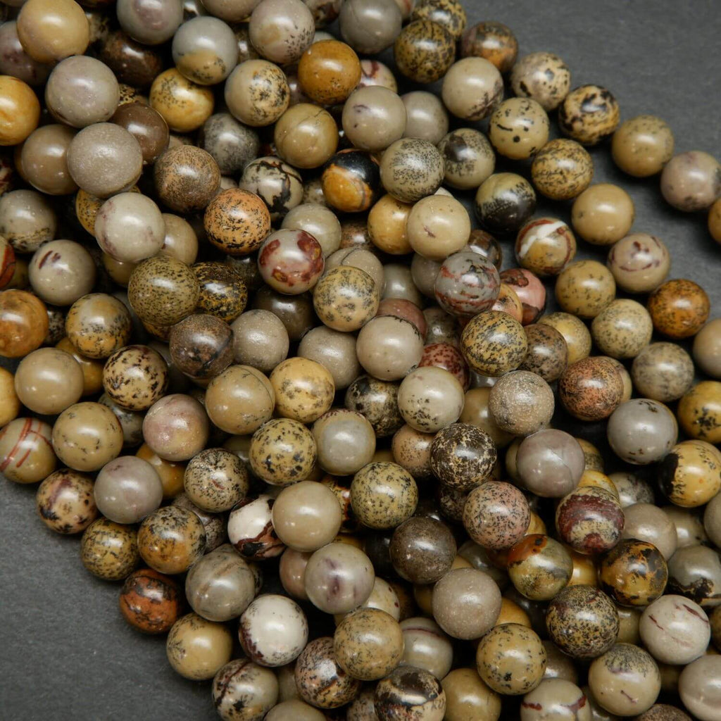 Artistic Jasper Loose Beads. Grey, yellow and beige beads round polished beads on a string.