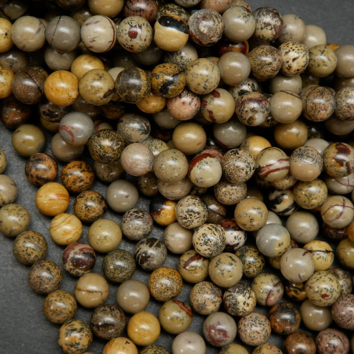 Artistic Jasper Loose Beads. Grey, yellow and beige beads round polished beads on a string.