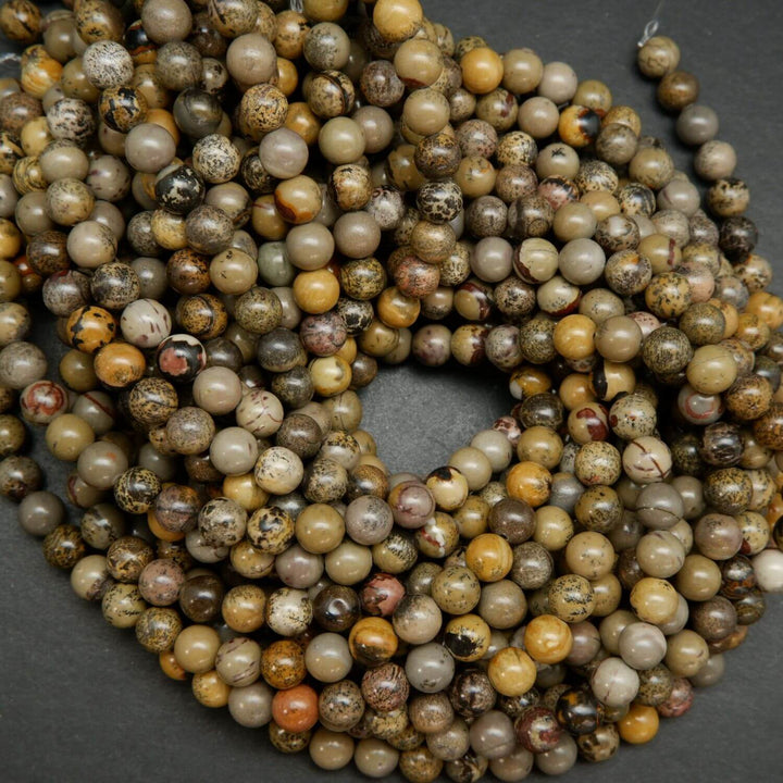 Artistic Jasper Loose Beads. Grey, yellow and beige beads round polished beads on a string.