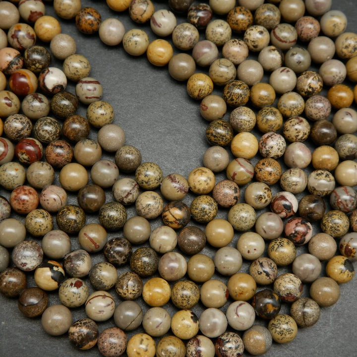 Artistic Jasper Loose Beads. Grey, yellow and beige beads round polished beads on a string.
