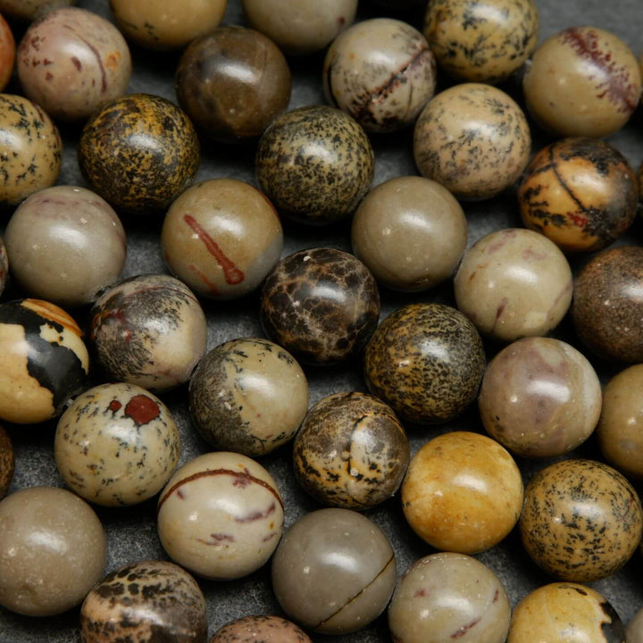 Artistic Jasper Loose Beads. Grey, yellow and beige beads round polished beads on a string.