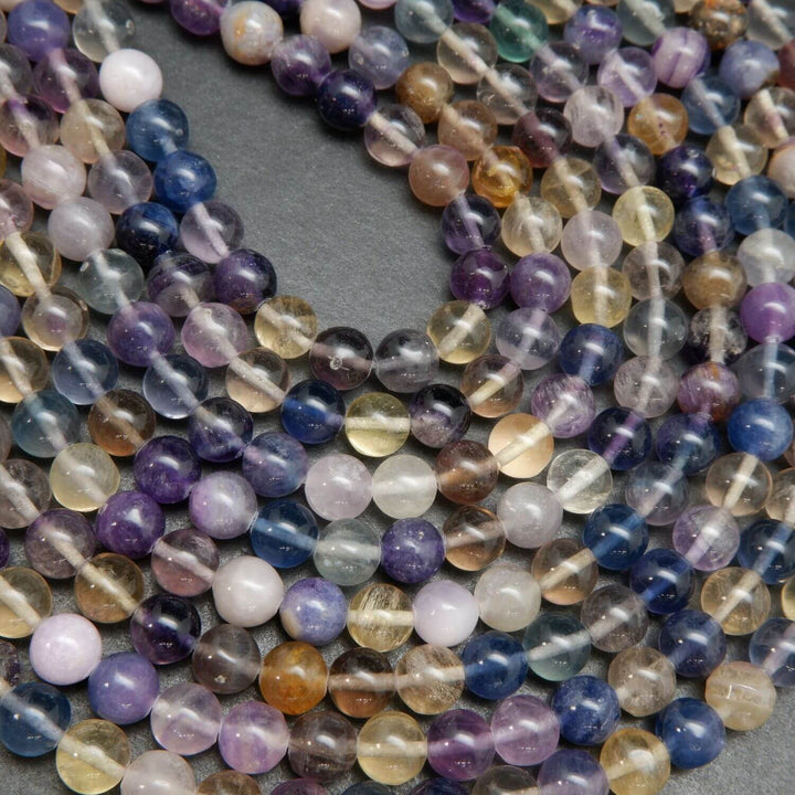 Rainbow fluorite loose beads on a string.
