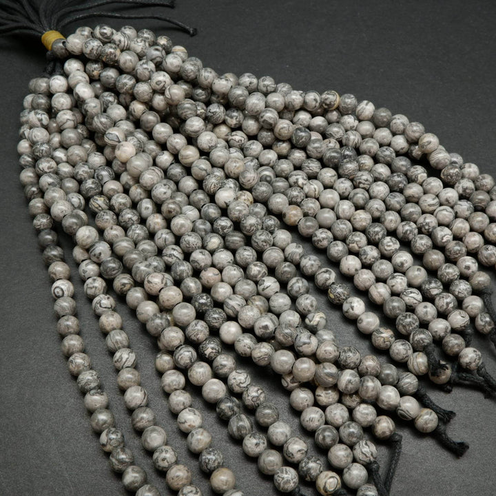 Large Hole Silver Crazy Lace Agate Beads. Silver round beads with a curvy patterning.