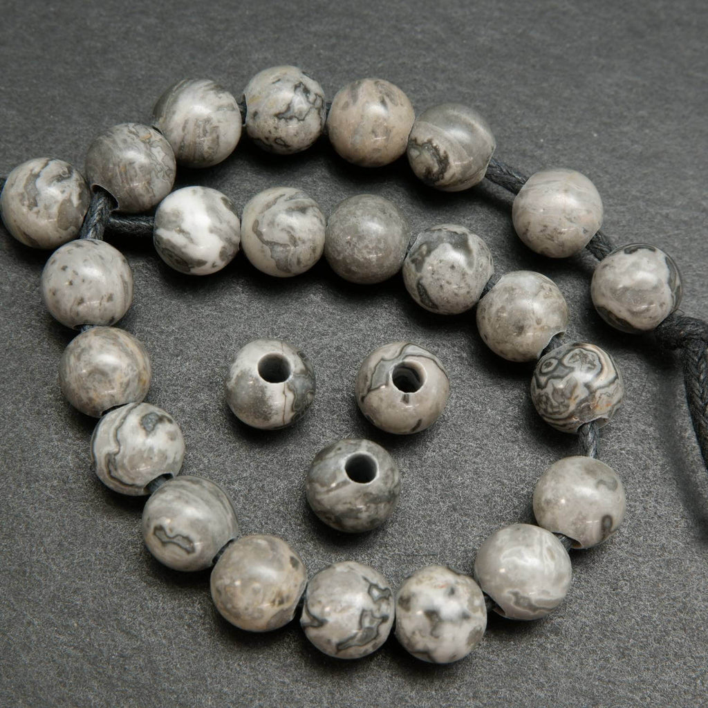 Large Hole Silver Crazy Lace Agate Beads. Silver round beads with a curvy patterning.