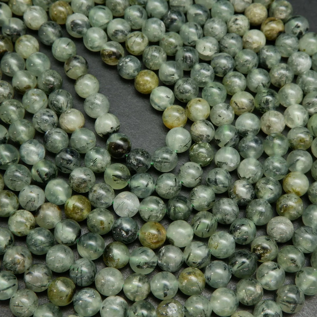Green Prehnite Beads With Epidote Needle Inclusions.