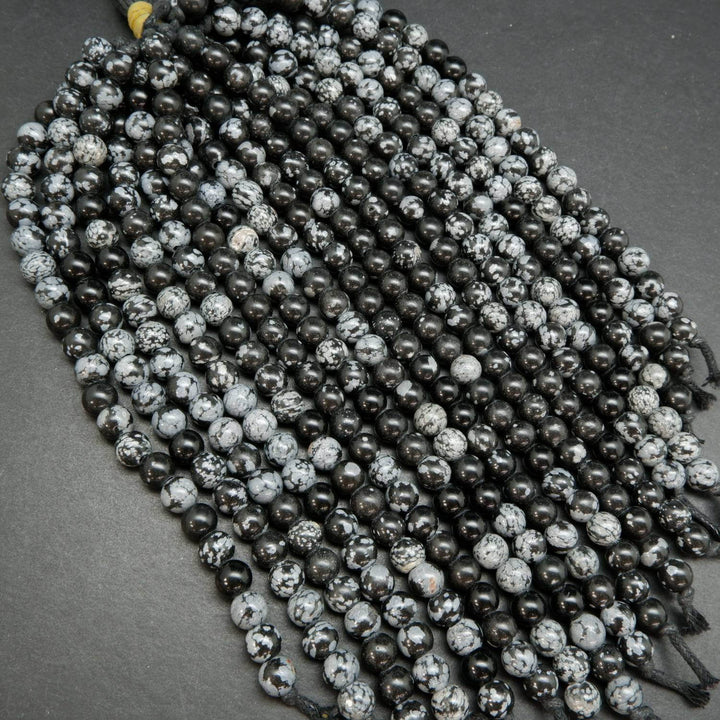 Snowflake-Obsidian-Beads. Large hole beads with snow like ash inclusions.