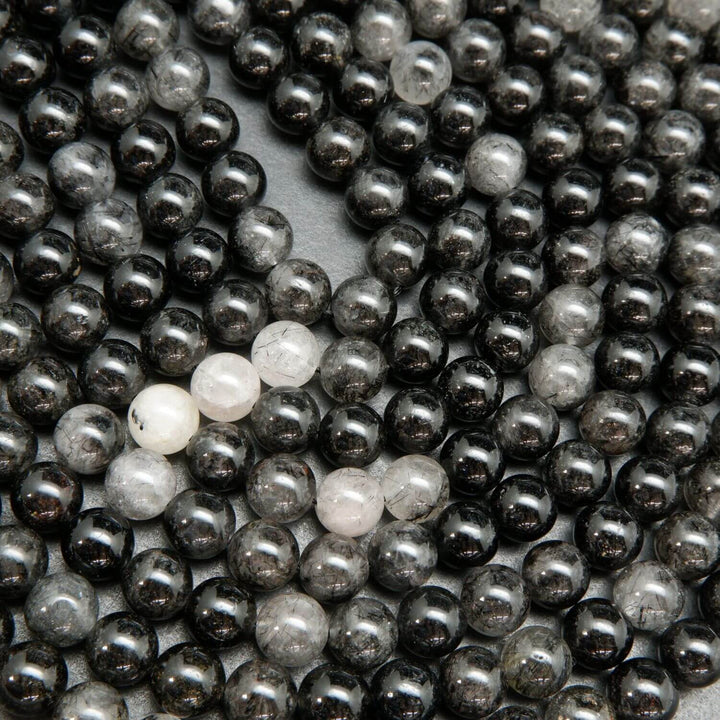 Fine tourmaline needles in quartz.