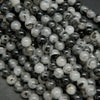 White and black tourmalated quartz beads.