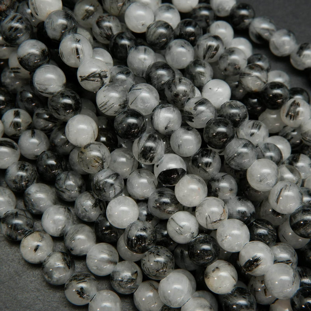 White and black tourmalated quartz beads.