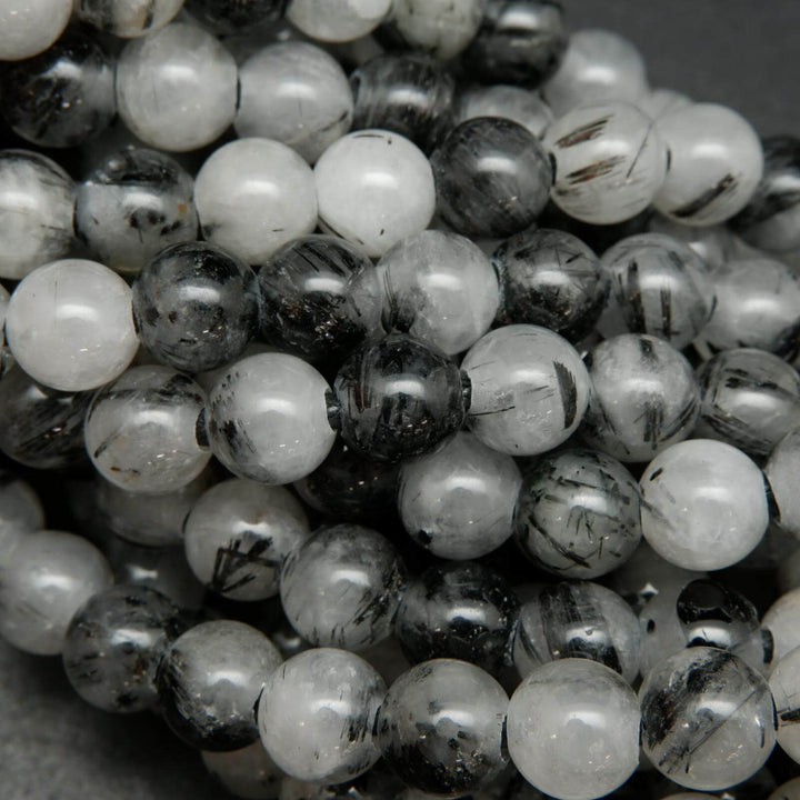 White and black tourmalated quartz beads.