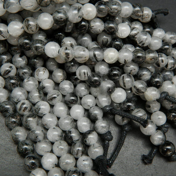 White and black tourmalated quartz beads.