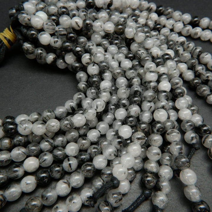 White and black tourmalated quartz beads.