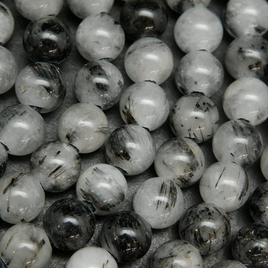 White and black tourmalated quartz beads.