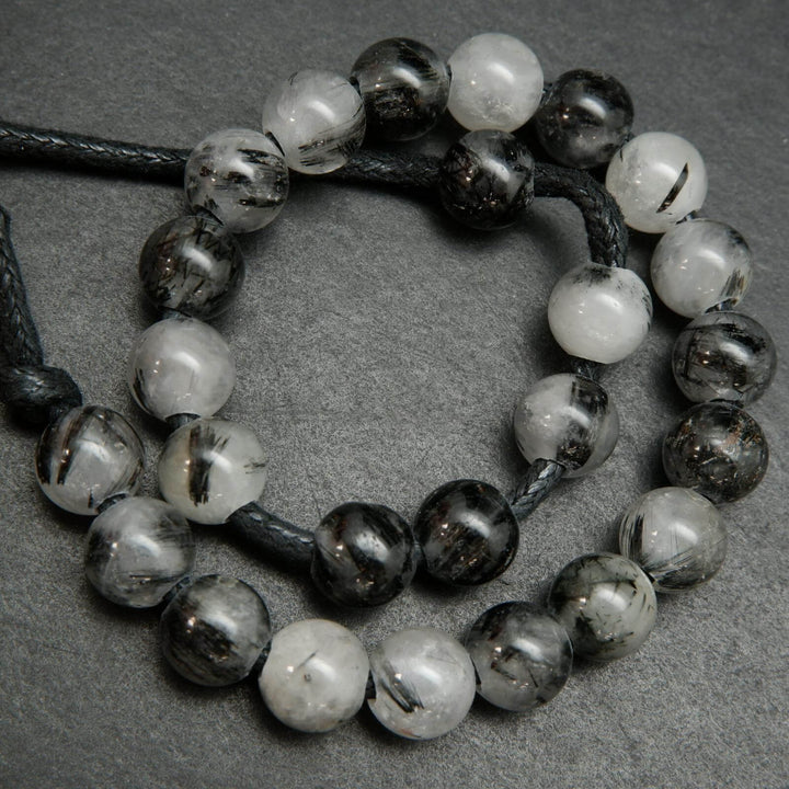 White and black tourmalated quartz beads.