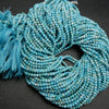 Microfaceted light blue turquoise beads.