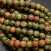 Drab green and pinkish orange unakite large hole beads.