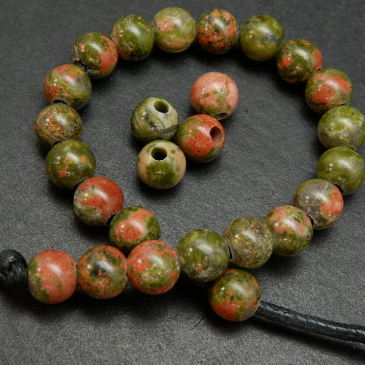 Drab green and pinkish orange unakite large hole beads.