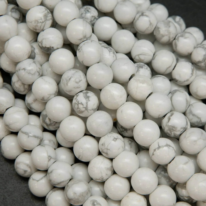 Polished large hole white howlite beads.