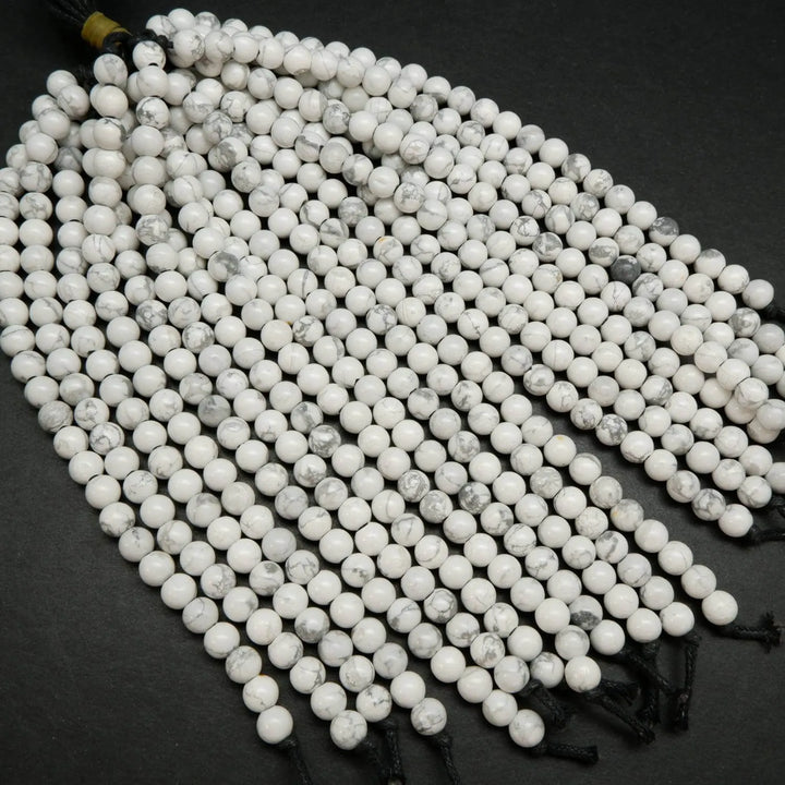 Polished large hole white howlite beads.