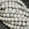 Polished large hole white howlite beads.