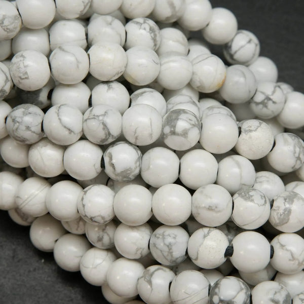 Polished large hole white howlite beads.