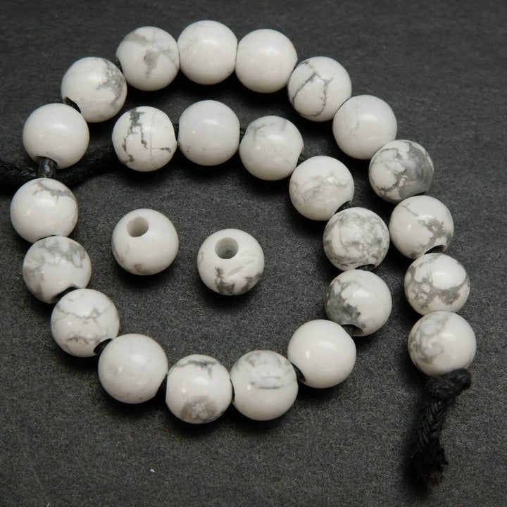 Polished large hole white howlite beads.