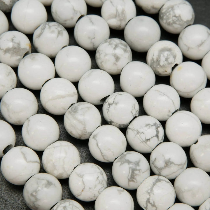 Polished large hole white howlite beads.