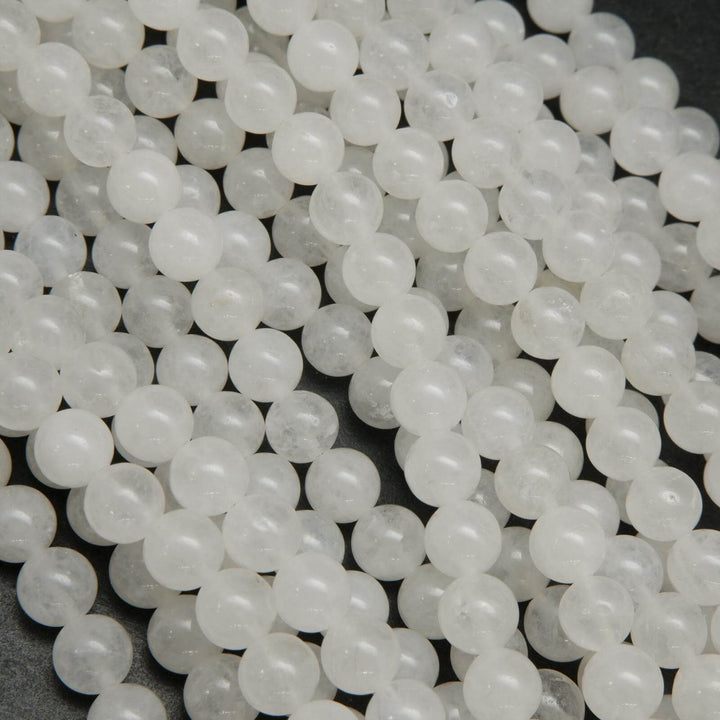 Polished round white jade beads.