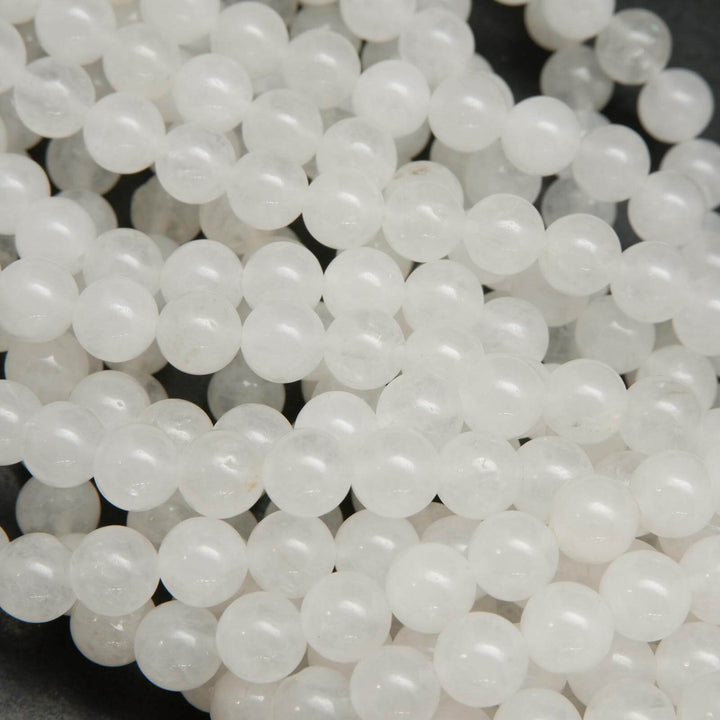 Polished round white jade beads.