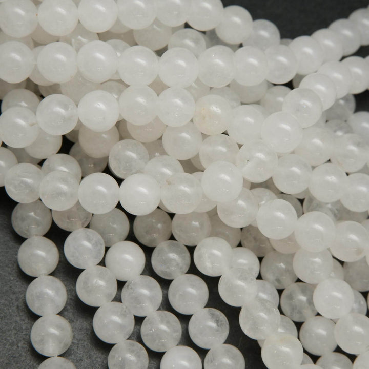 Polished round white jade beads.