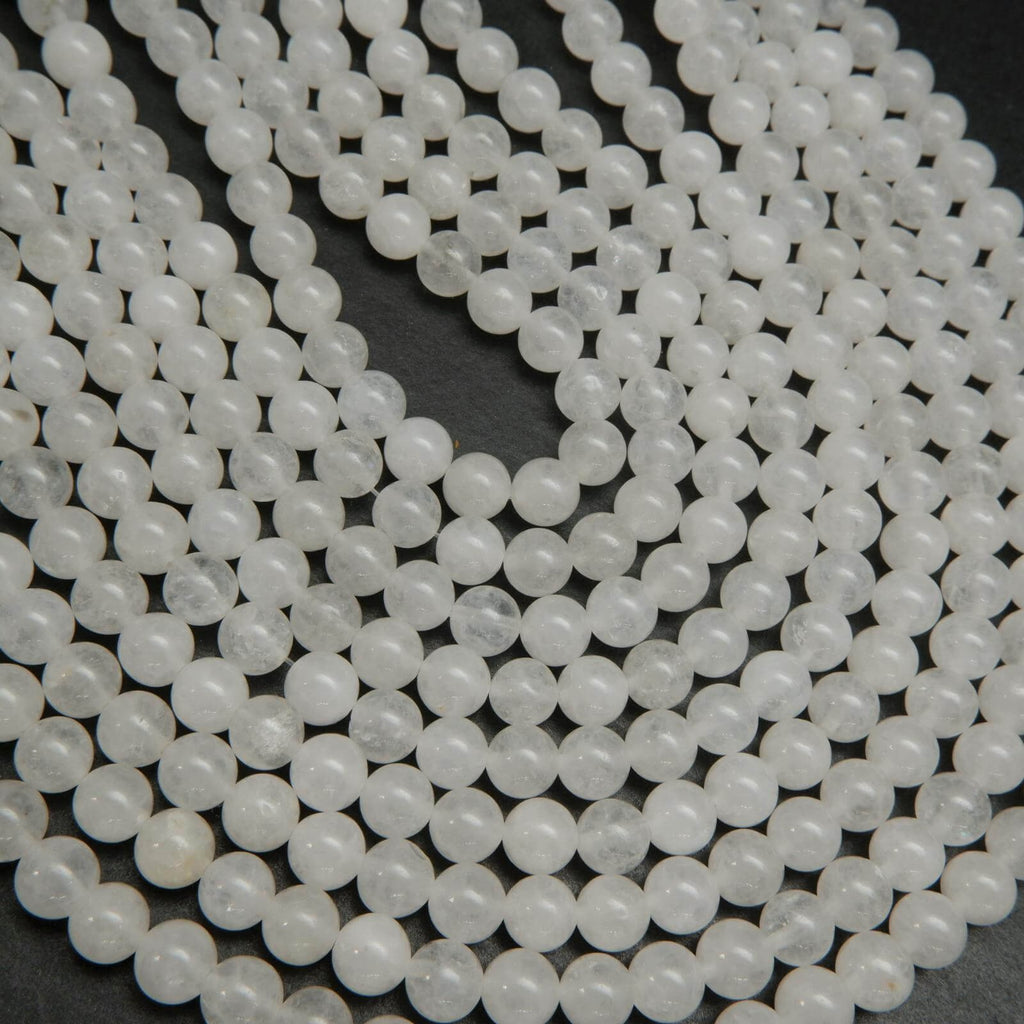 Polished round white jade beads.
