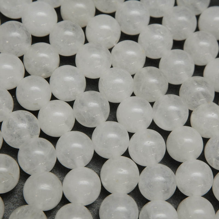 Polished round white jade beads.