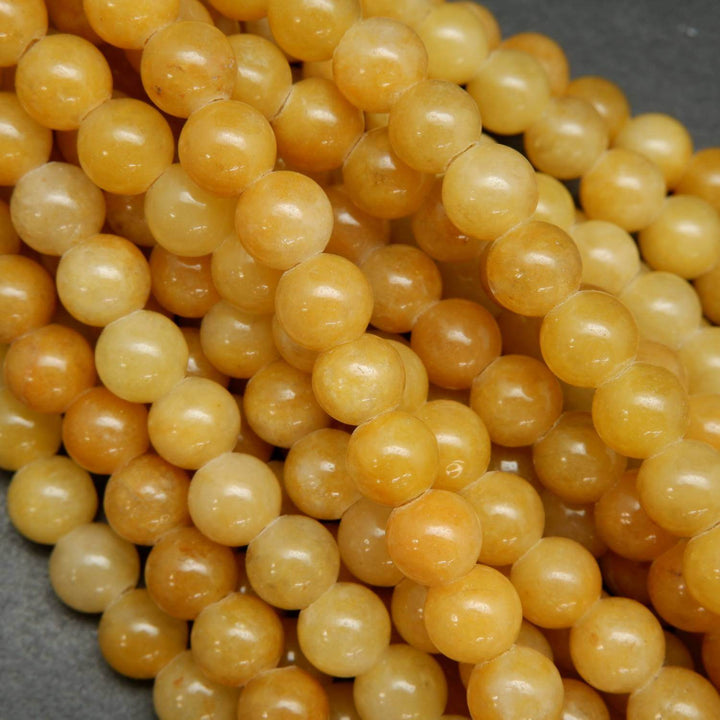 Yellow jade large hole loose beads.